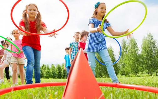 Campers playing sport relay