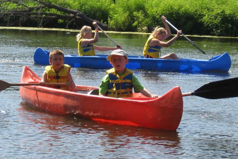 Campers canoeing adventure